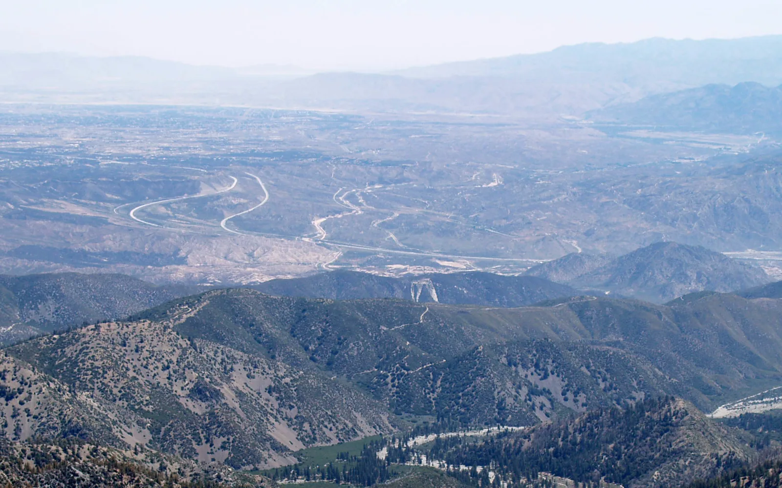Cajon Pass showing the San Gabriel Mountains in the foreground and San Bernardino Mountains in the distance, the geographic gateway to Highland